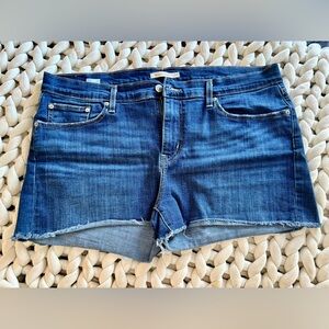 Levi’s mid-length cut off denim shorts
